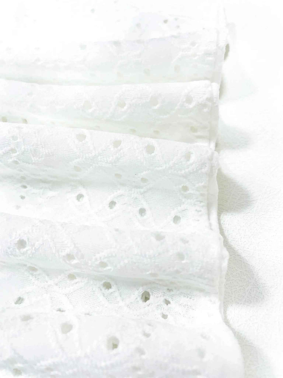 Elevate Your Summer Style with the White Eyelet Sleeveless Boho Tank Blouse