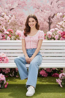 Blusa rosa com jeans